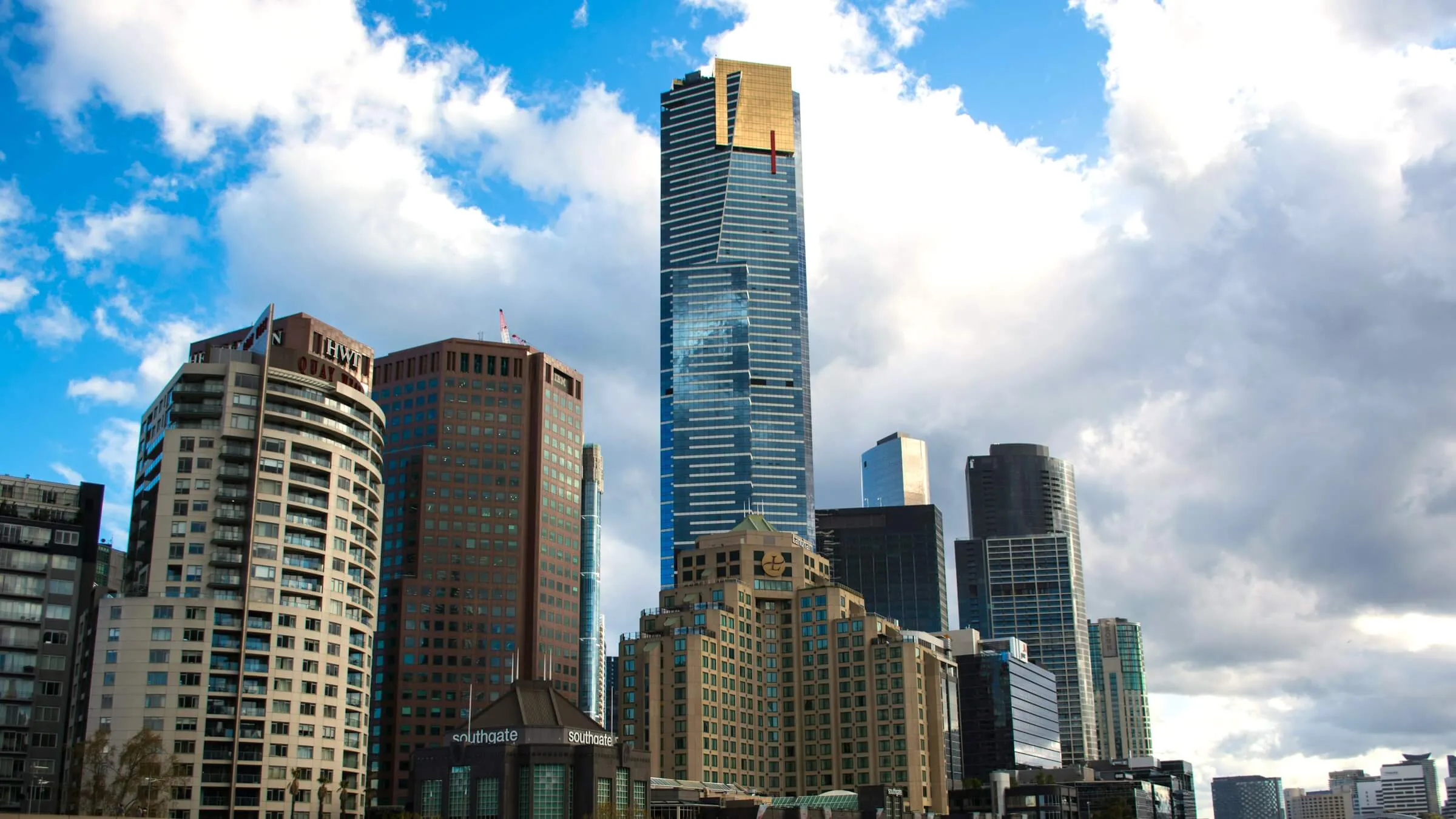 Eureka Tower by day, its gold-plated top floors and red stripe above the Southbank towers